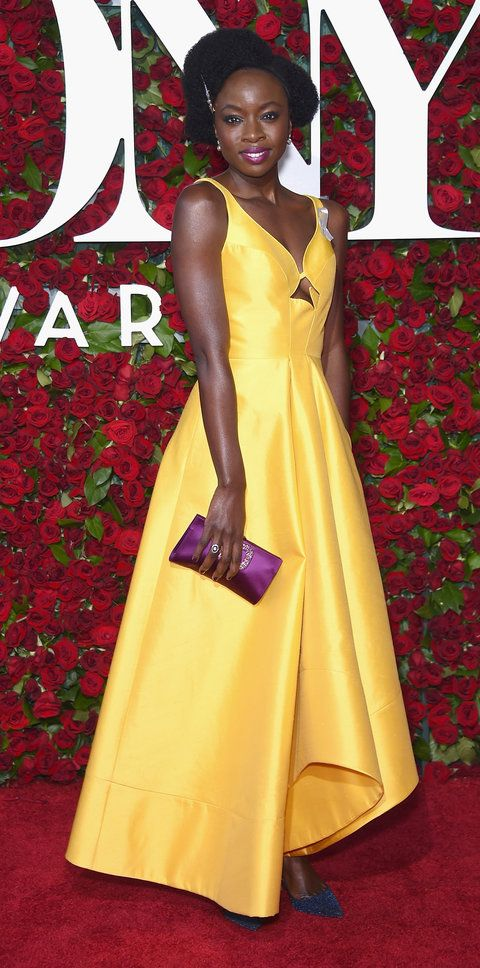 A glamorous canary yellow dress as elegantly showcased by Gurira