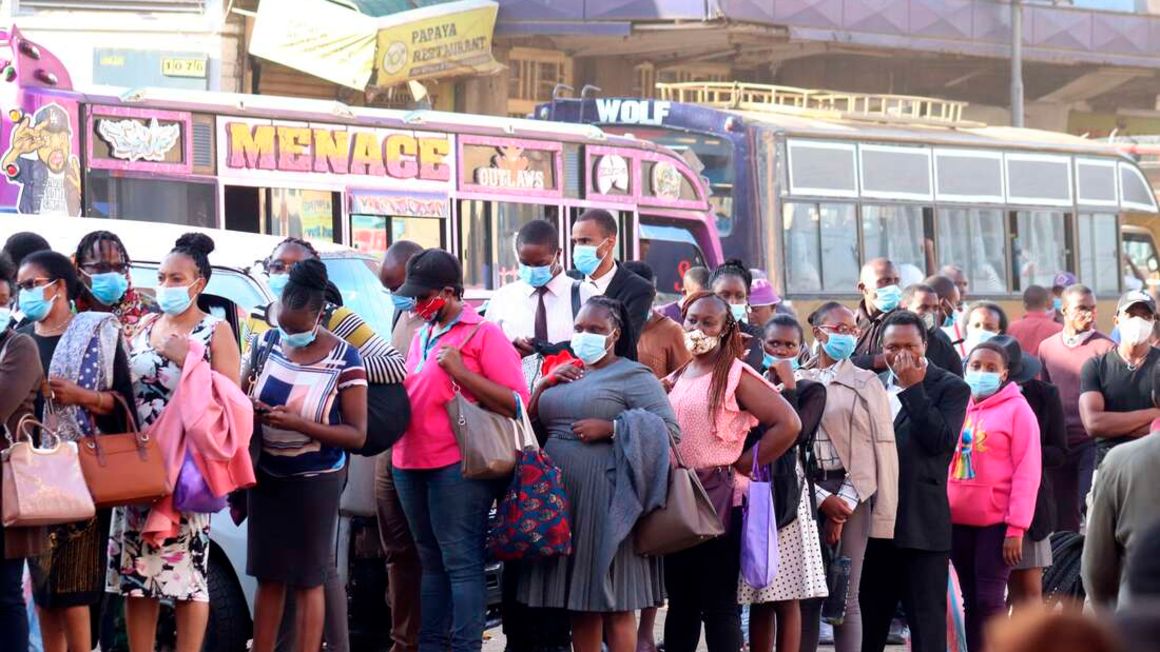 Passengers waiting to board a bus